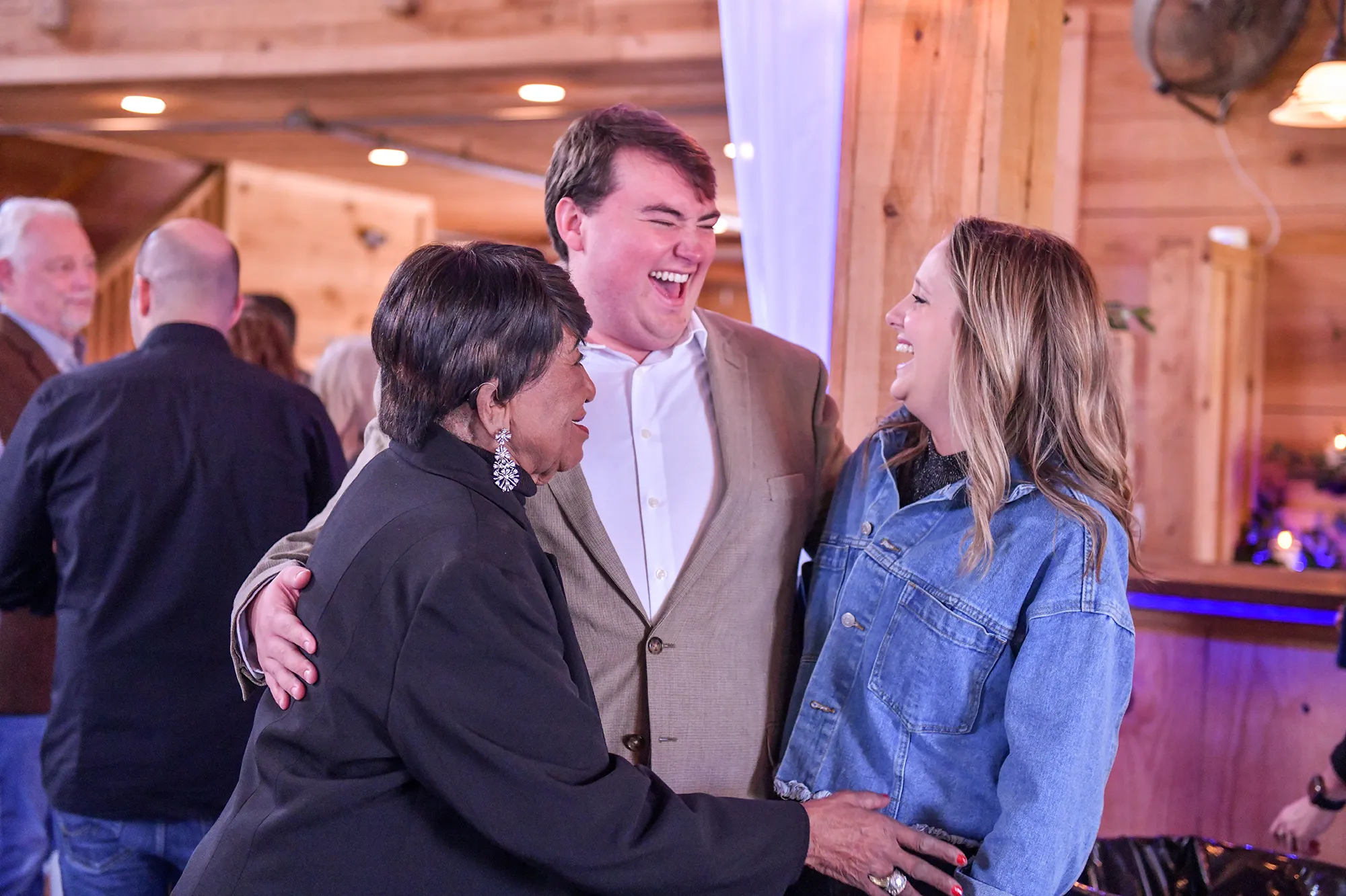 Happy gentleman smiling with two ladies